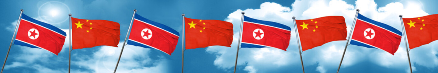 North Korea flag with China flag, 3D rendering