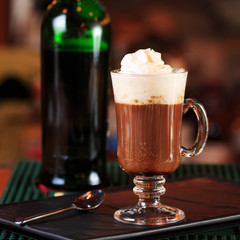 Irish coffee in a bar. Concept of St Patrick holiday. Holiday ba
