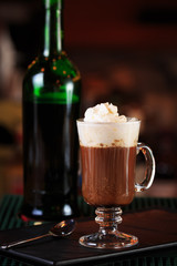 Irish coffee in a bar. Concept of St Patrick holiday. Holiday ba