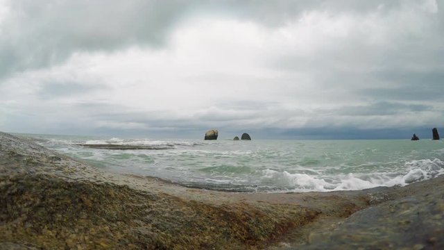 Waves on a rocky beach at day