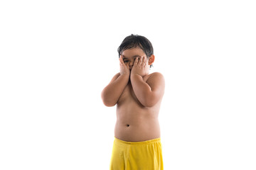 Obraz premium Cute little boy standing and looking at camera, enjoy playing.