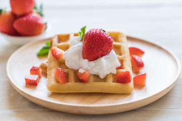 waffle with strawberry on wood