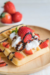 waffle with strawberry on wood