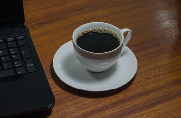 Black coffee on the wooden table