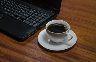 Obraz na płótnie Canvas Black coffee on the wooden table