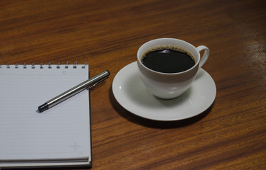 Black coffee on the wooden table