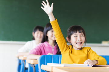 happy little girl learning in the classroom