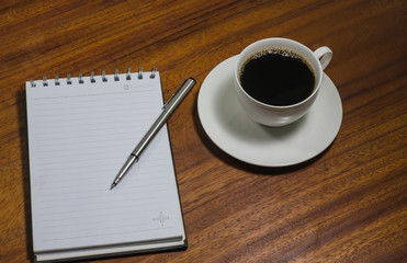 Black coffee on the wooden table