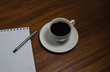 Black coffee on the wooden table