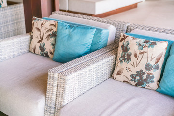 Closeup of modern furniture with pillows .