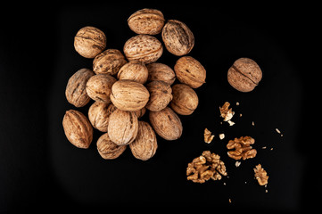 Walnuts isolated on black background