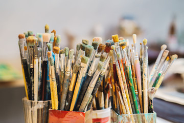 Fototapeta premium a lot Paint Brushes isolated in blur background, close-up