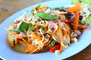 Herb salad with deep fried fish