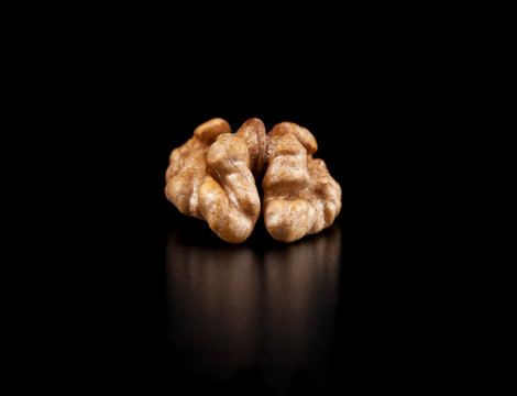 Walnuts isolated on black background