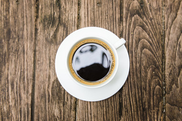 Black coffee on the wooden table