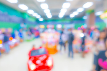 Abstract blur people in Interior game zone of shopping center .