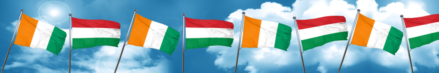 Naklejka na ściany i meble Ivory coast flag with Hungary flag, 3D rendering