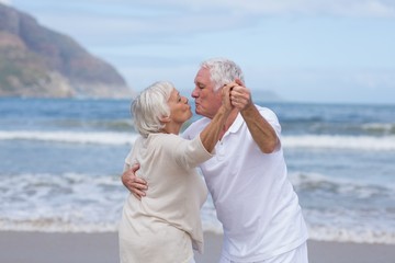 Senior couple having fun together at beach