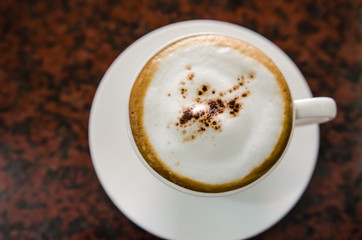 Barista making a cup of coffee soft focus image .