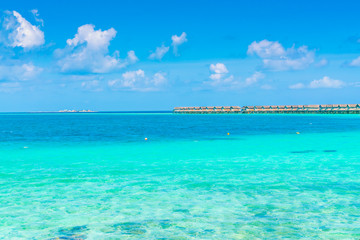 Fototapeta na wymiar Beautiful water villas in tropical Maldives island .