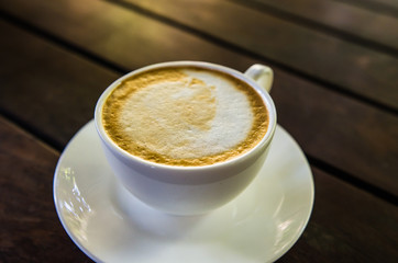 Barista making a cup of coffee soft focus image .