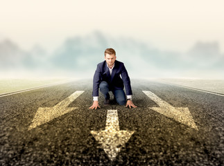 Businessman kneeling in ready position