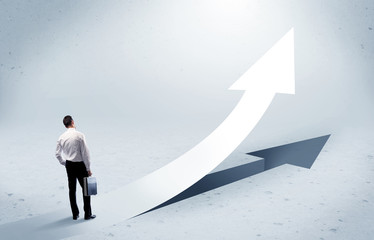 Arrow pointing up with standing salesman