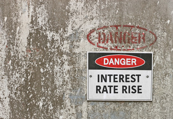 red, black and white Danger, Interest Rate Rise warning sign