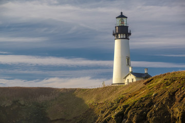 Fototapeta na wymiar Yaquina Head Lighthouse at Pacific coast, built in 1873