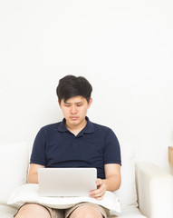 Asian man working at home