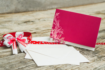 Wedding Invitation card crafting of cardboard lying on a wooden