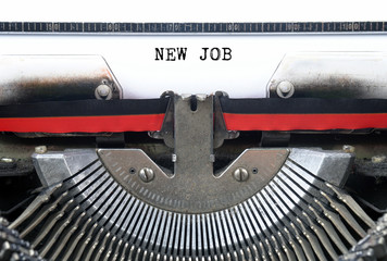 NEW JOB typed words on a Vintage Typewriter Conceptual