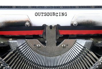 OUTSOURCING typed words on a Vintage Typewriter Conceptual