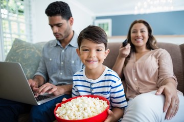 boy with mother watching television 