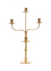 Old brass candle holder on white background