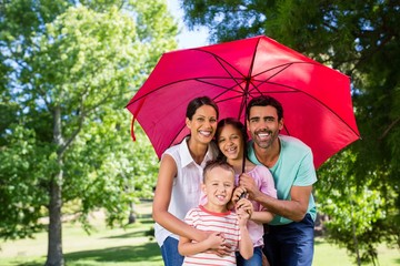 Portrait of happy family enjoying time together in the park © WavebreakMediaMicro