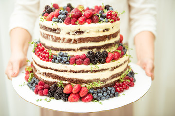 Cake with berries, three level, wedding concept