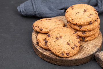 Oatmeal chocolate chip cookies on a cutting board. Delicious dessert