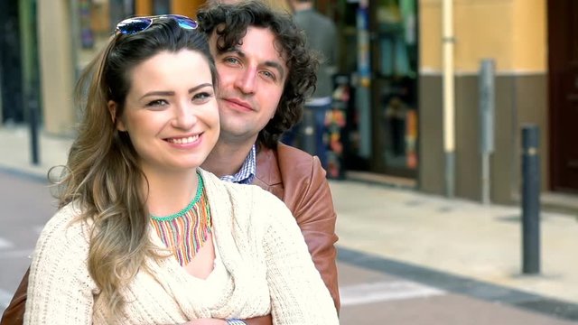 Lovely couple smiling to the camera, steadycam shot, slow motion shot at 240fps
