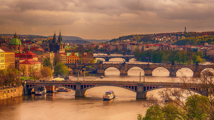 Fototapeta na wymiar Prague, Czech Republic: romantic bridges that crosses Vltava river 