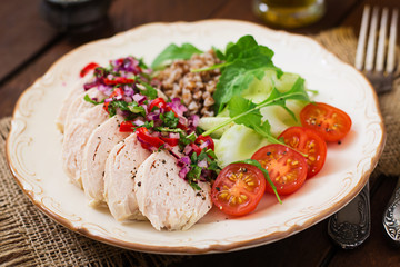Fototapeta na wymiar Diet food. Chicken breast with buckwheat and vegetables. Healthy lifestyle. Sports nutrition.