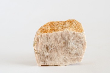 Piece of orthoclase ore on white background