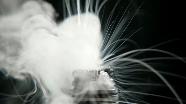 working of micro coil in RDA base close-up, slow motion