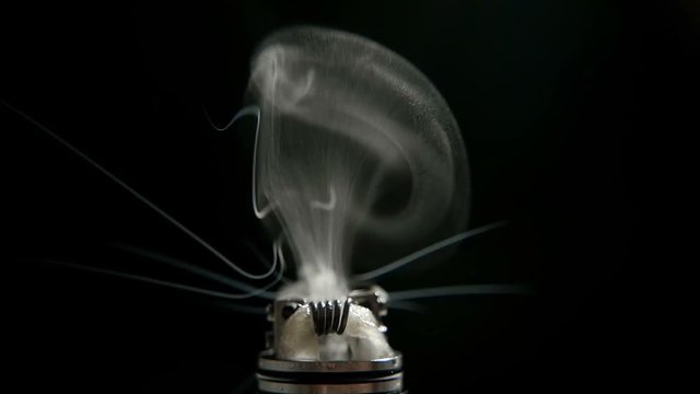 working of micro coil in RDA base close-up, slow motion