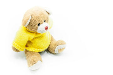 Brown Teddy Bear toy wear yellow shirts sitting on White background