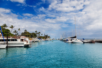 Kayak dwarfed by larger boats in Lahaina Maui