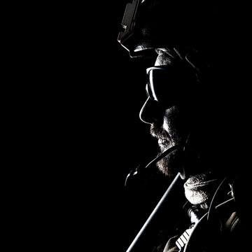 United states Marine Corps special operations command Marsoc raider. Contour backlit studio shot of Marine Special Operator black background