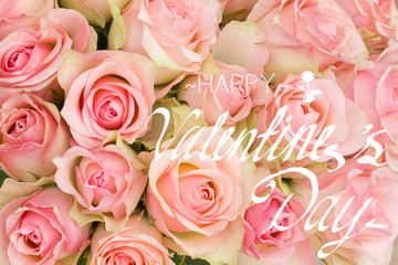 bouquet of pink luxury roses close up with happy valentines day greeting