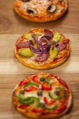 Various delicious pizza served on pizza tray