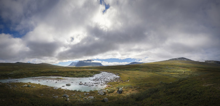 Enormous landscape panorama of Sarek with Sami shelter and tents